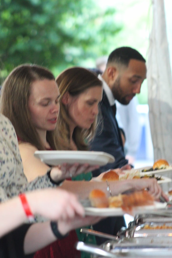 3 people eating a meal at a table