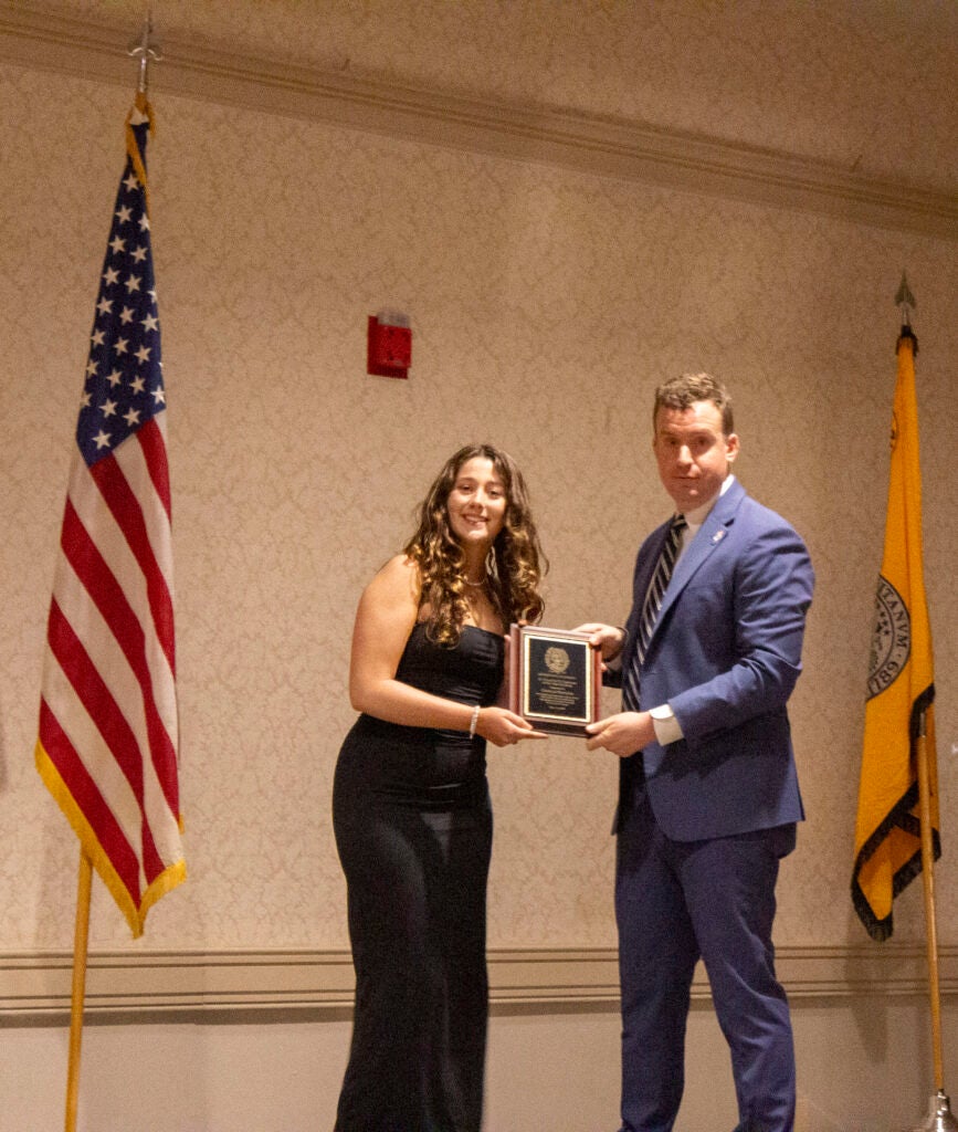 Student receiving award