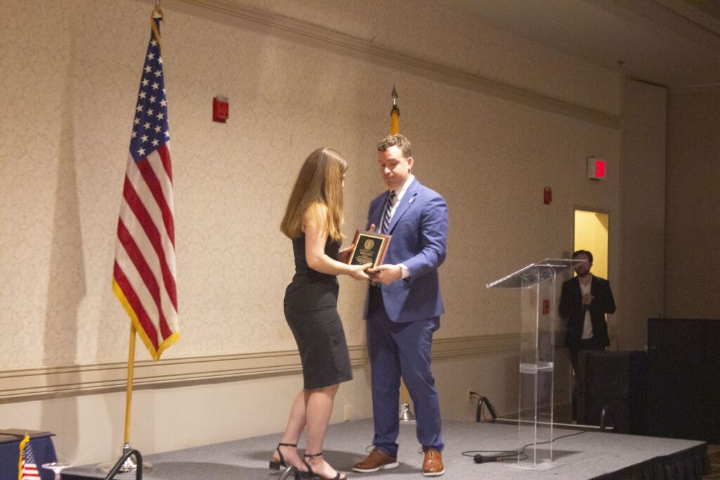 Student receiving award