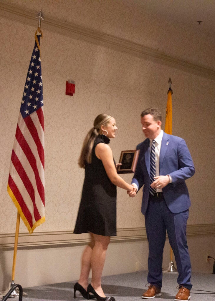 Student receiving award