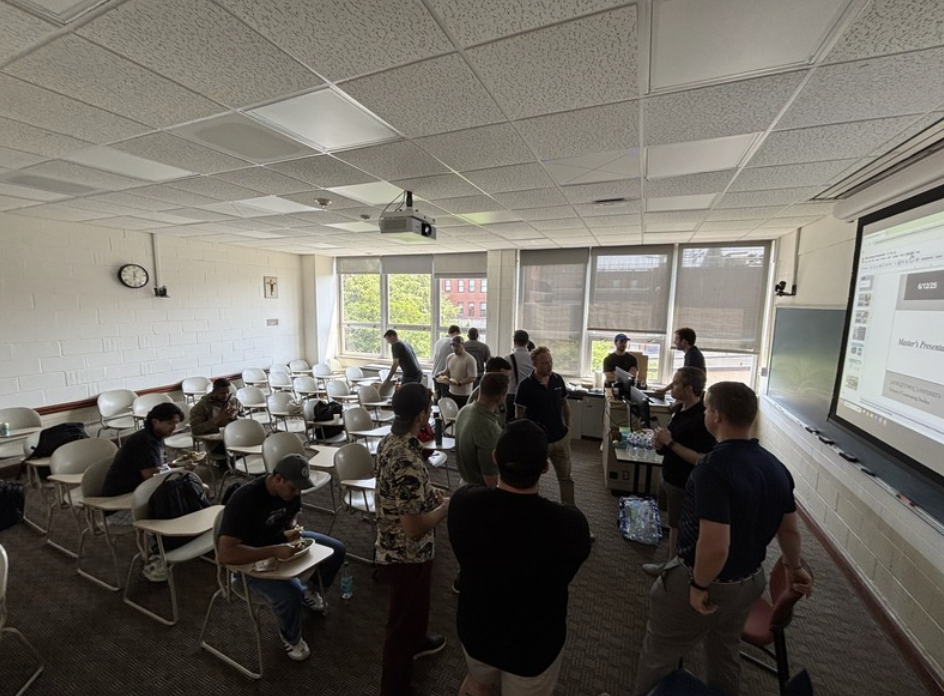 students mingling after a classroom presentation