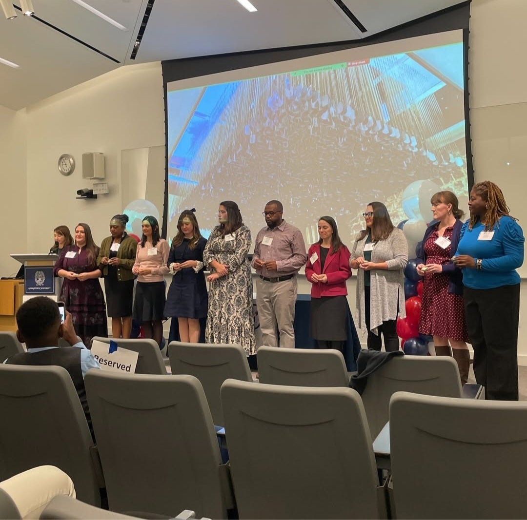 group of dog tag fellows in front of a screen