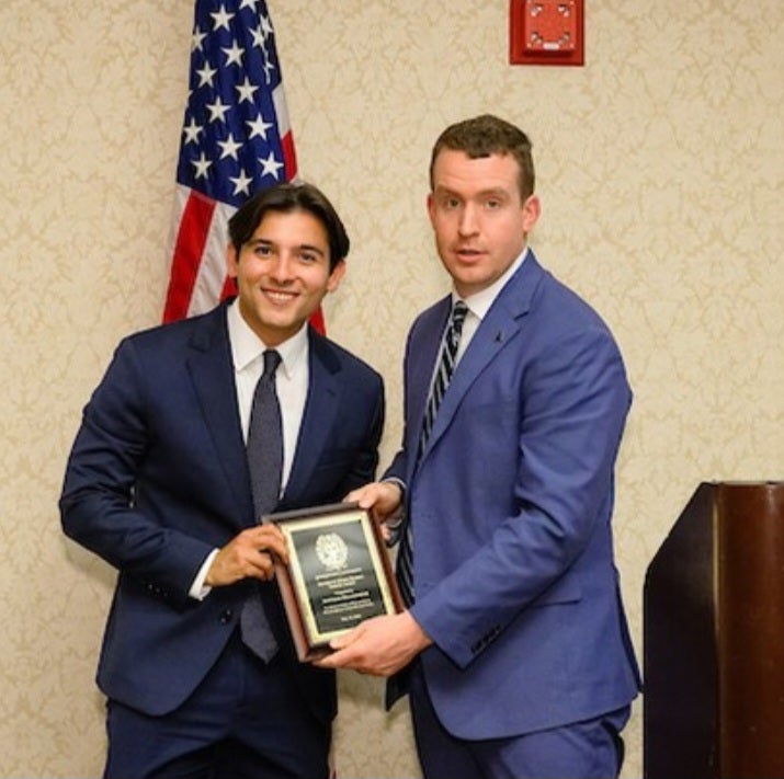 Student receiving award