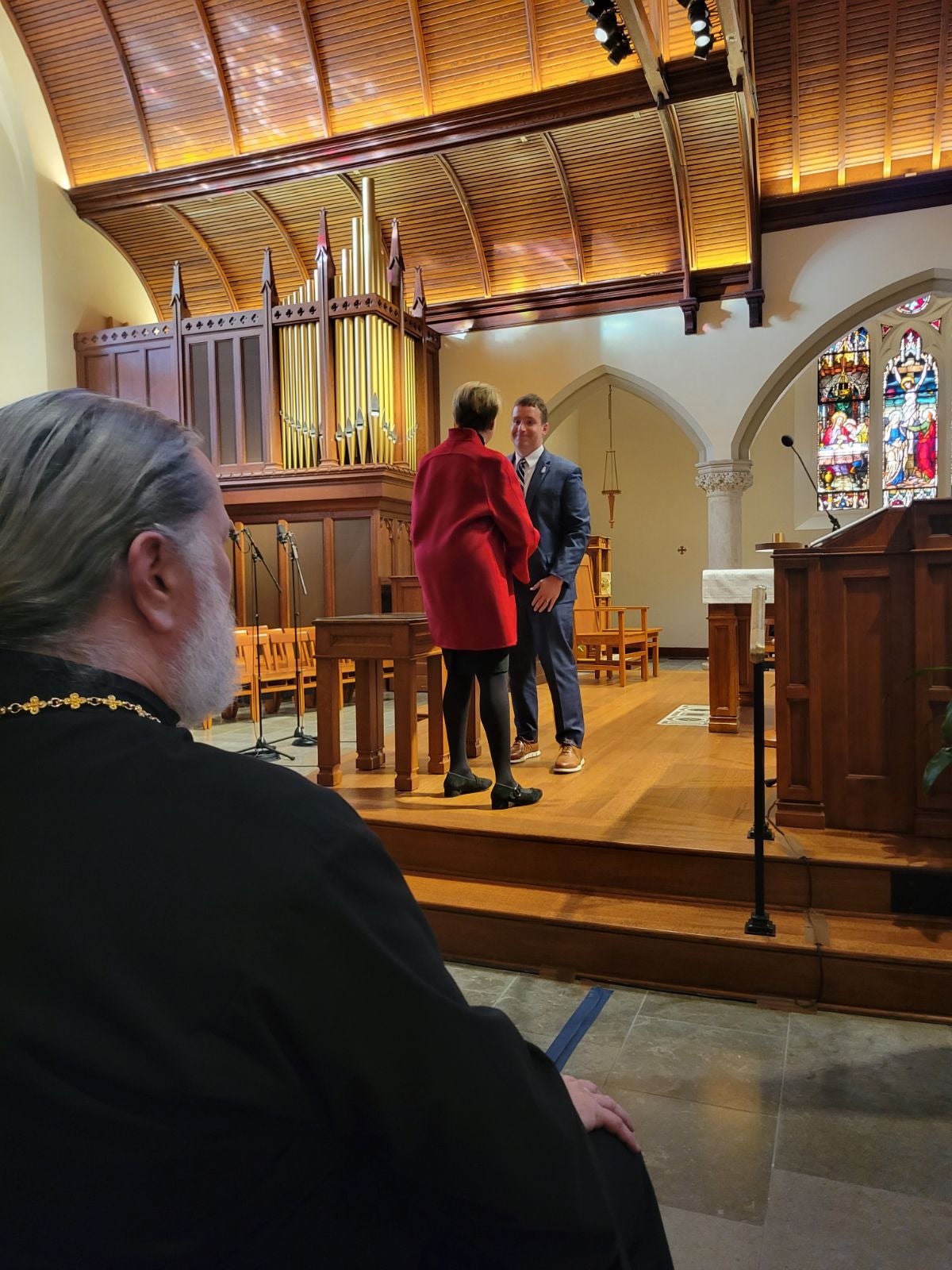 Director Murphy handing honorary flag to keynote speaker