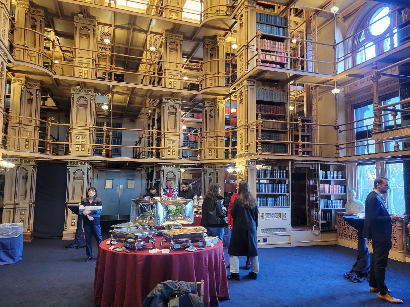 Empty reception hall with food table in the center