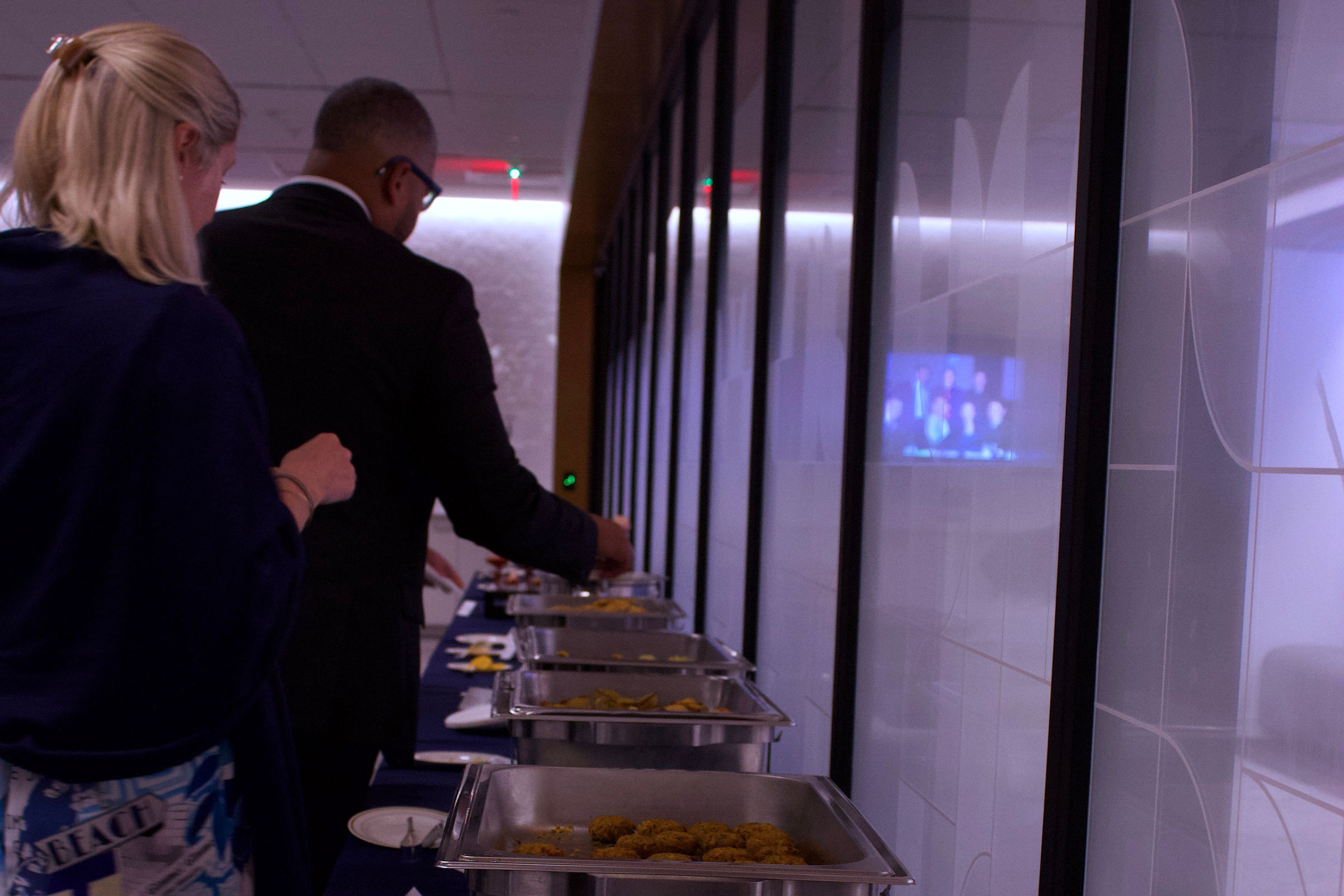 People getting food from a buffet