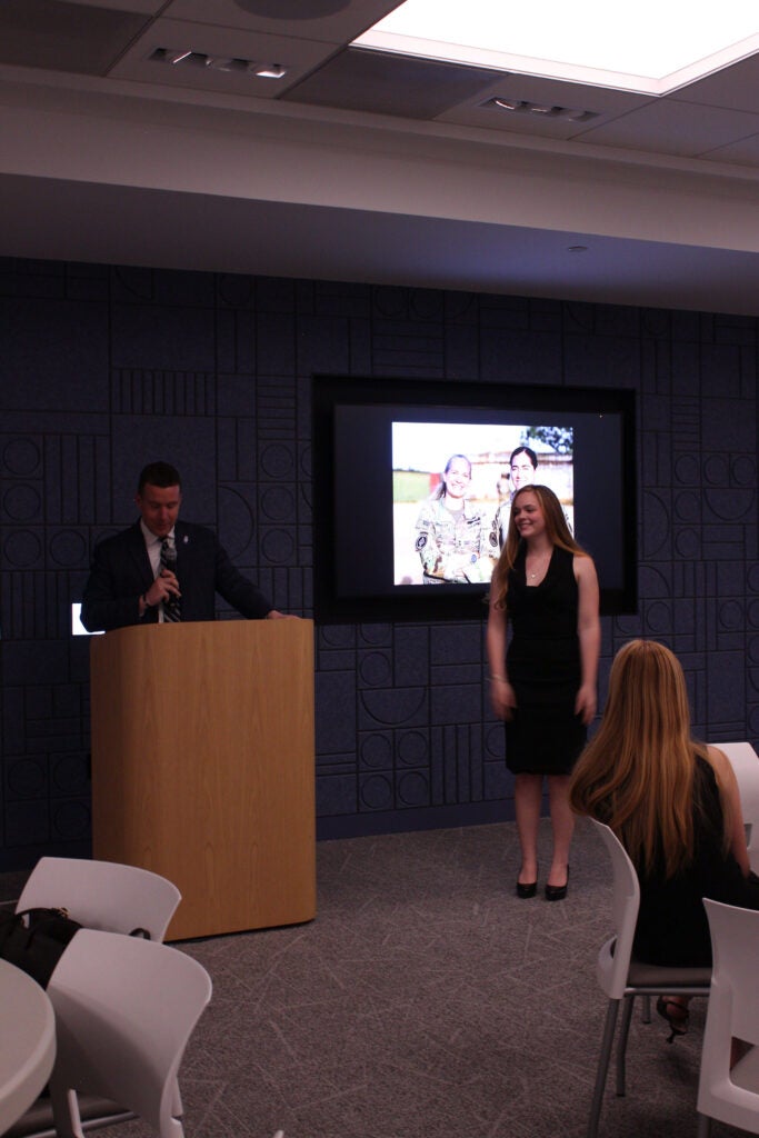 Stephan Murphy presenting a plaque to Gemma Love