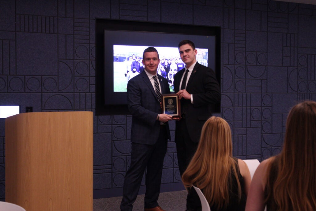  Nicholas Plachta and Stephan Murphy posing for photo with plaque