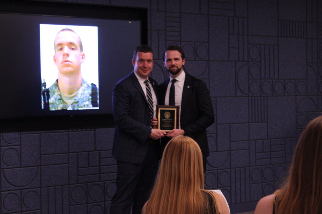 Greg Doty and Stephan Murphy posing for photo with plaque